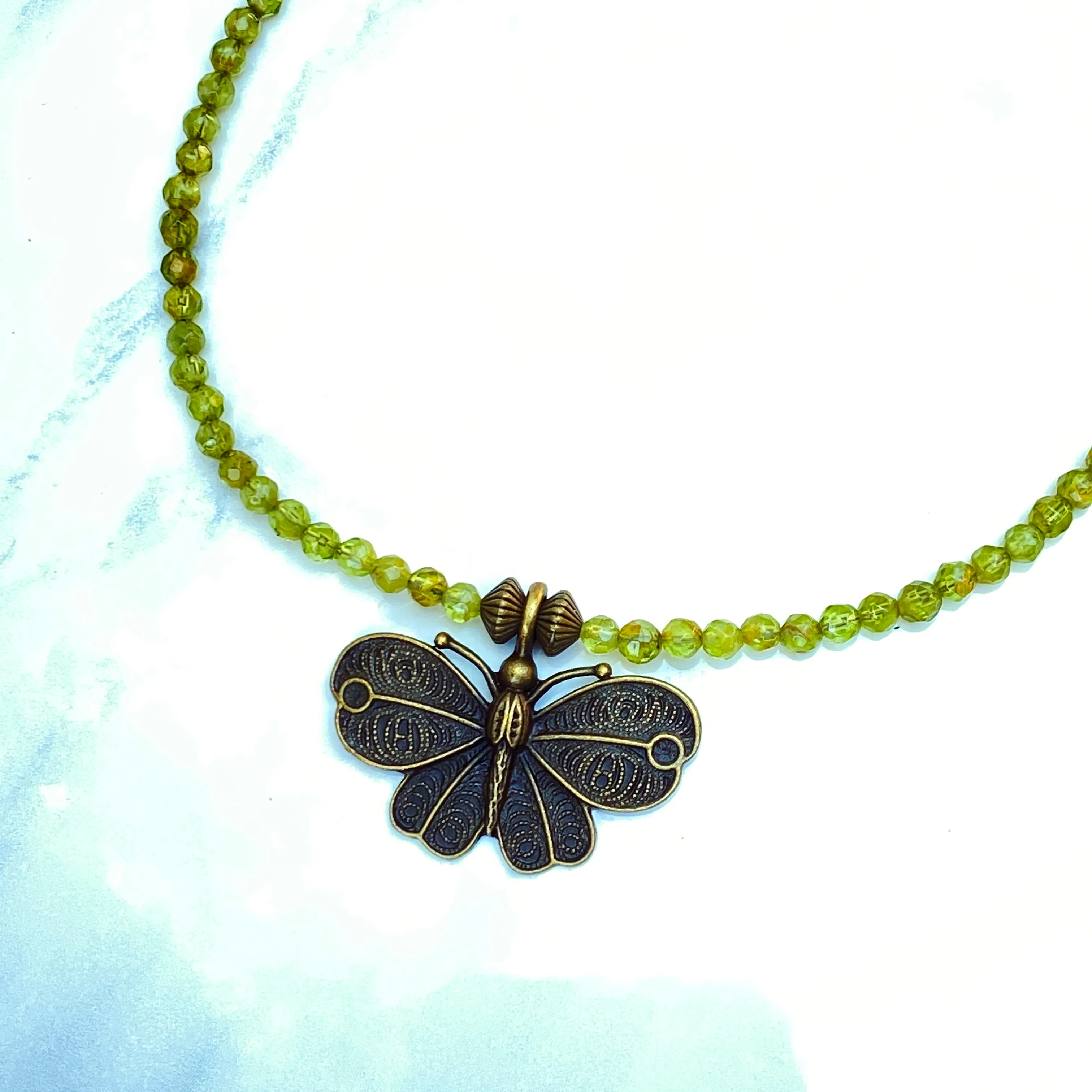 Peridot gemstone and Brass Butterfly Necklace