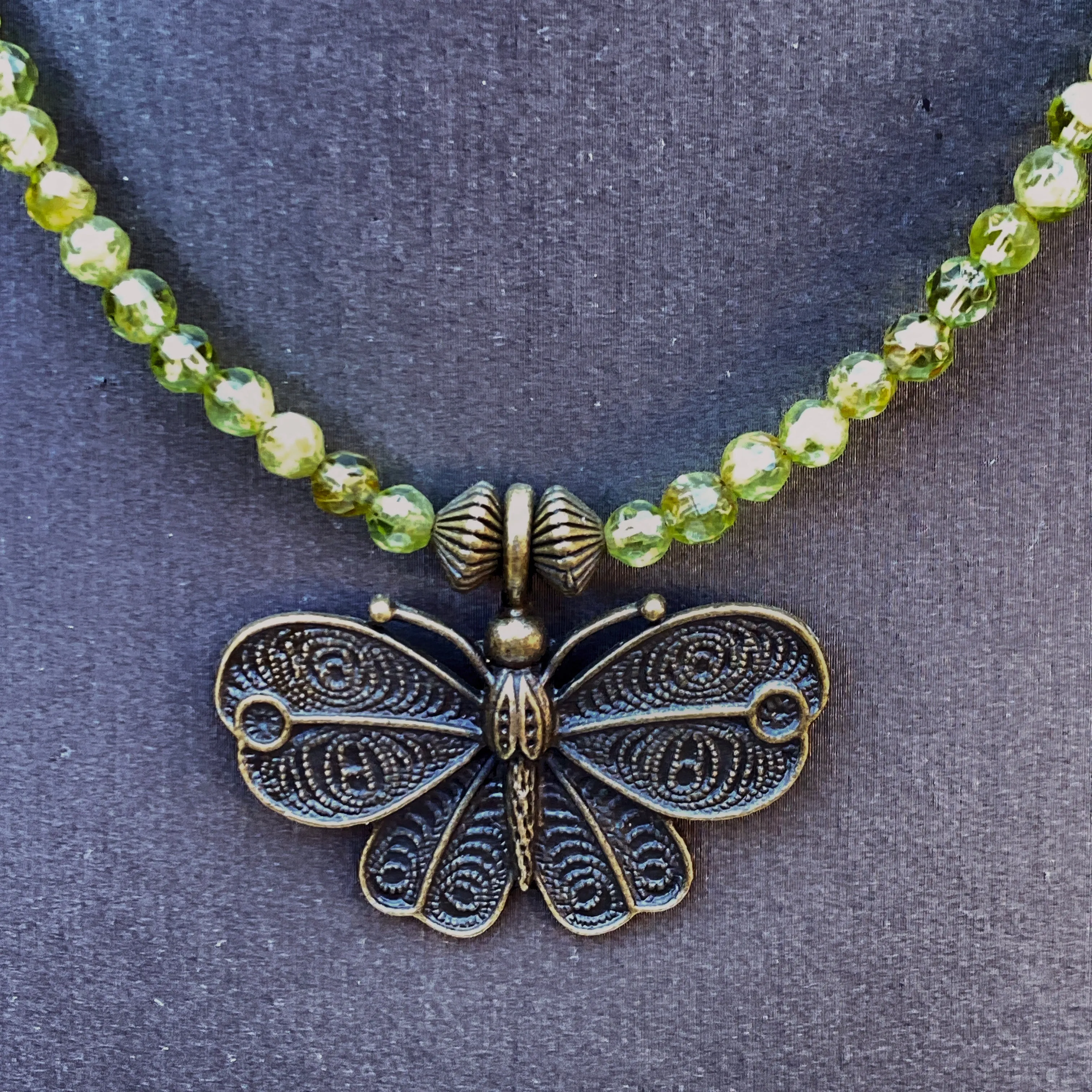 Peridot gemstone and Brass Butterfly Necklace